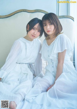A couple of young women standing next to each other.