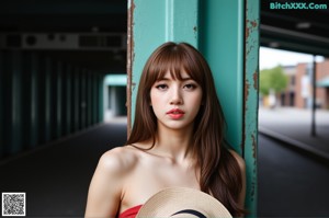 A woman in a yellow dress is standing on the street.