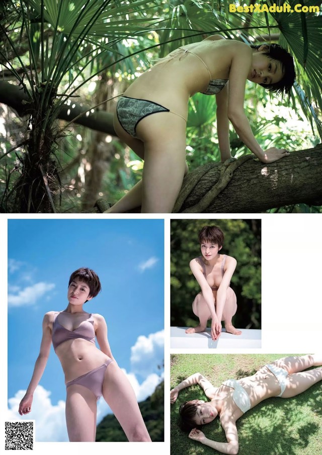 A woman in a bikini posing on a tree branch.