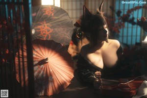 A woman in a kimono sitting on a cat with an umbrella.